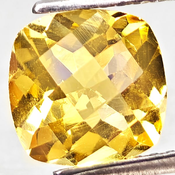 Natural Yellow Citrine 1.90 Ct. Cushion Checkerboard Cut 8 x 8.1 Mm Gemstone From Brazil: Product ID: 801815223 Product Name: Natural Citrine Weight: 1.90 CT. Size: 8 x 8.1 x 5.4 MM. Shape: Cushion Checkerboard Cut Color: Yellow Clarity:VVS - VSI Luster: Good Gems Origin: Brazil Treatment: