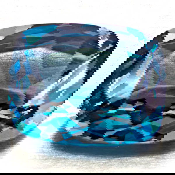 Natural London Blue Topaz 4.56 Ct. Cushion Shape 11 x 8.7 Mm Gemstone From Brazil: Product ID: 807168317 Product Name: Natural Blue Topaz Weight: 4.56 CT. Size: 11 x 8.7 x 5.2 MM. Shape: Cushion Shape Color: London Blue Clarity:VVS - VSI Luster: Good Gems Origin: Brazil Treatment: T