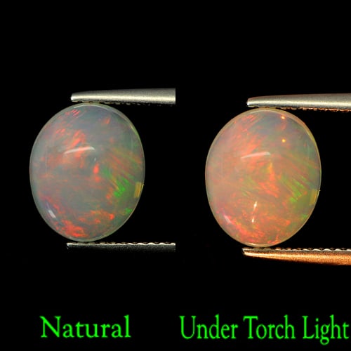 Natural Multi Color Opal 3.23 Ct. Oval Cabochon Shape 10.9 x 9 Mm Gemstone From Ethiopia: Product ID: 818727509 Product Name: Natural Opal Weight: 3.23 CT. Size: 10.9 x 9 x 6.6 MM. Shape: Oval Cabochon Color: Multi-Color Clarity:Semi - Transparent Luster: Good Gems Origin: Ethiopia Treatme