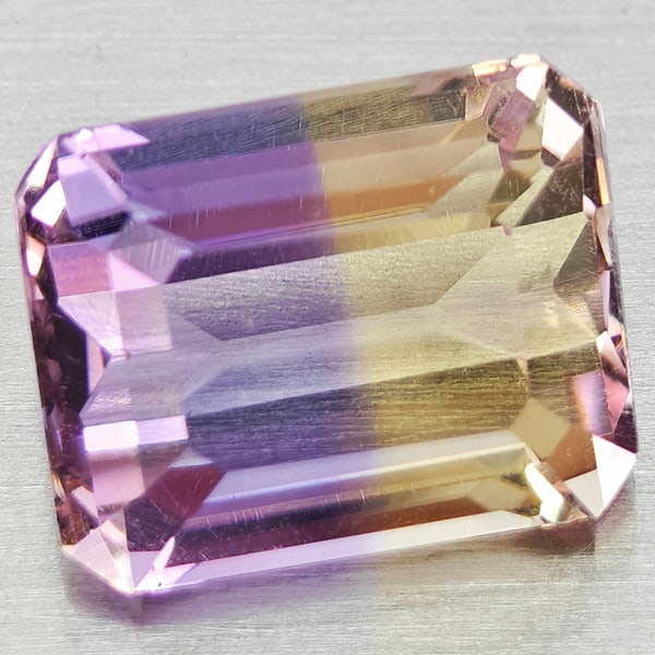 Natural Bi Color Ametrine 2.66 Ct. Octagon Shape 9.1 x 7.1 Mm Gemstone From Bolivia: Product ID: 800408441 Product Name: Natural Ametrine Weight: 2.66 CT. Size: 9.1 x 7.1 x 5.5 MM. Shape: Octagon Color: Bi Color Clarity:VSI Luster: Good Gems Origin: Bolivia Treatment: Unheated Crystal
