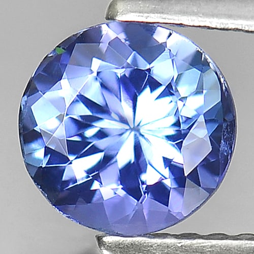 Natural Violetish Blue Tanzanite 1.02 Ct. Round Shape 6.5 Mm Gemstone From Tanzania: Product ID: 807009526 Product Name: Natural Tanzanite Weight: 1.02 CT. Size: 6.5 x 6.5 x 4 MM. Shape: Round Color: Violetish Blue Clarity:VSI Luster: Good Gems Origin: Tanzania Treatment: Heated Cryst