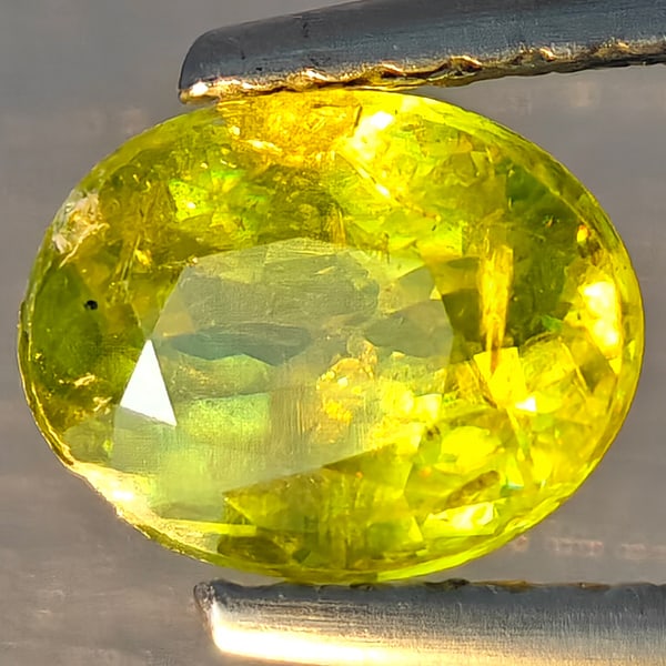 Natural Multi-Color With Rainbow Spark Sphene 1.19 Ct. Oval Shape 7.2 x 5.6 Mm Gemstone From (1 of 3)