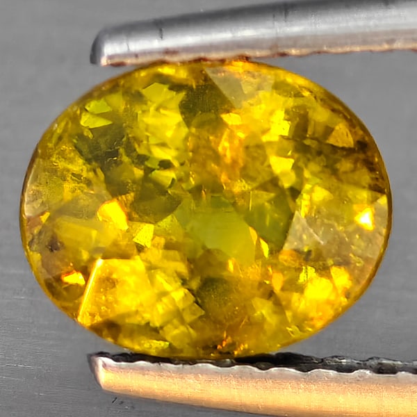 Natural Multi-Color With Rainbow Spark Sphene 1.69 Ct. Oval Shape 8.1 x 6.6 Mm Gemstone From (1 of 3)