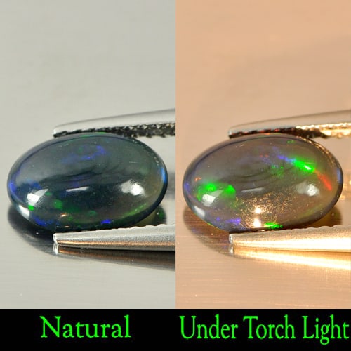Natural Fire Red Black Opal 0.91 Ct. Oval Cabochon Shape 9.8 x 6.8 Mm. Gemstone: Product ID: 818724387 Product Name: Natural Opal Weight: 0.91 CT. Size: 9.8 x 6.8 x 3.1 MM. Shape: Oval Cabochon Color: Rainbow Fire Red Black Clarity:Semi - Transparent Luster: Iridescent Gems Origin