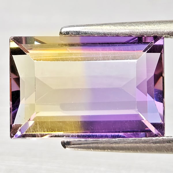 Natural Bi Color Ametrine 3.03 Ct. Octagon Shape 10.7 x 7.2 Mm Gemstone From Bolivia: Product ID: 800408403 Product Name: Natural Ametrine Weight: 3.03 CT. Size: 10.7 x 7.2 x 4.8 MM. Shape: Octagon Color: Bi Color Clarity:VSI - SI1 Luster: Good Gems Origin: Bolivia Treatment: Unheated 