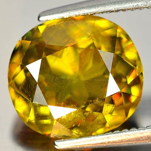 Natural Multi Color Sphene With Rainbow Spark 3.85 Ct. Oval Shape 10 x 9 Mm. Gemstone: Product ID: 806507061 Product Name: Natural Sphene Weight: 3.85 CT. Size: 10 x 9 x 5.5 MM. Shape: Oval Color: Multi Color With Rainbow Spark Clarity:SI1 Luster: Adamantine Gems Origin: Madagascar Trea
