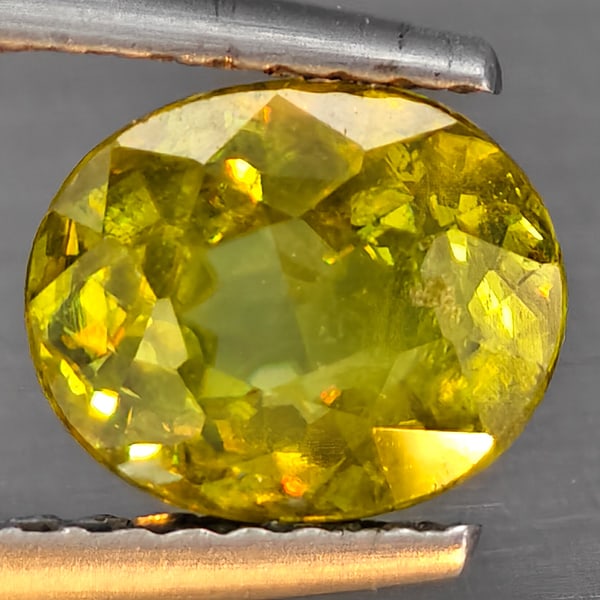 Natural Multi-Color With Rainbow Spark Sphene 1.63 Ct. Oval Shape 7.8 x 6.4 Mm Gemstone From: Product ID: 806509110 Product Name: Natural Sphene Weight: 1.63 CT. Size: 7.8 x 6.4 x 4.2 MM. Shape: Oval Shape Color: Multi-Color Clarity:SI1 Luster: Good Gems Origin: Madagascar Treatment: Unheated