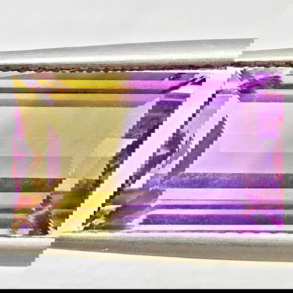 Natural Bi Color Ametrine 3.01 Ct. Baguette Shape 13.8 x 8.4 Mm Gemstone From Bolivia: Product ID: 800408567 Product Name: Natural Ametrine Weight: 3.01 CT. Size: 13.8 x 8.4 x 6.1 MM. Shape: Baguette Color: Bi Color Clarity:VSI Luster: Good Gems Origin: Bolivia Treatment: Unheated Cryst