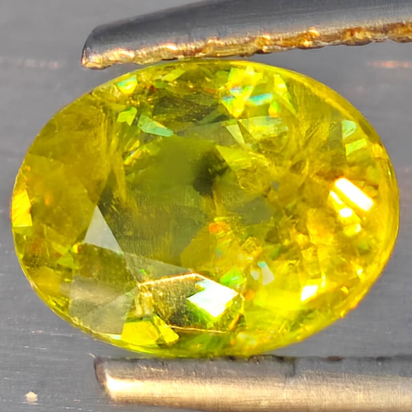 Natural Multi-Color With Rainbow Spark Sphene 1.06 Ct. Oval Shape 7.3 x 5.5 Mm Gemstone From (1 of 3)