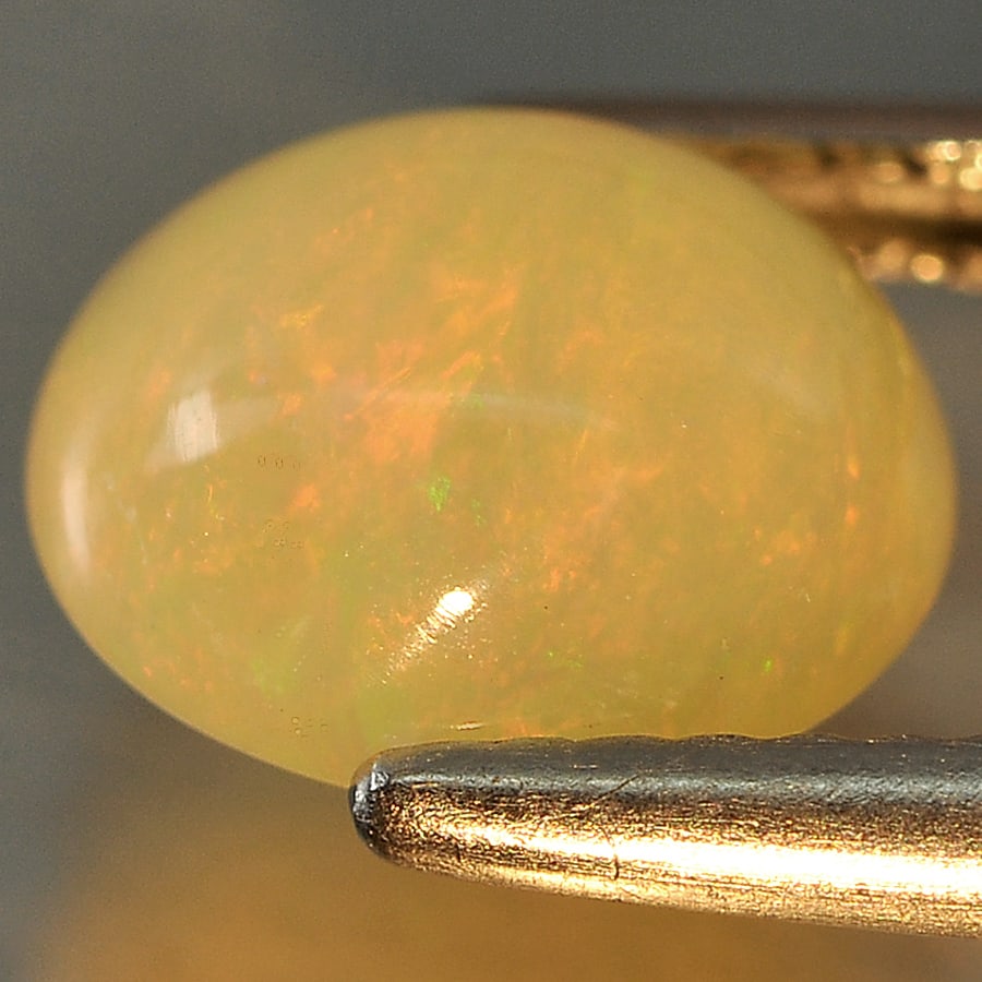 Natural Multi Color 1.45 Ct. Oval Cabochon Shape 8.6 x 7.5 Mm Gemstone from Ethiopia (1 of 3)