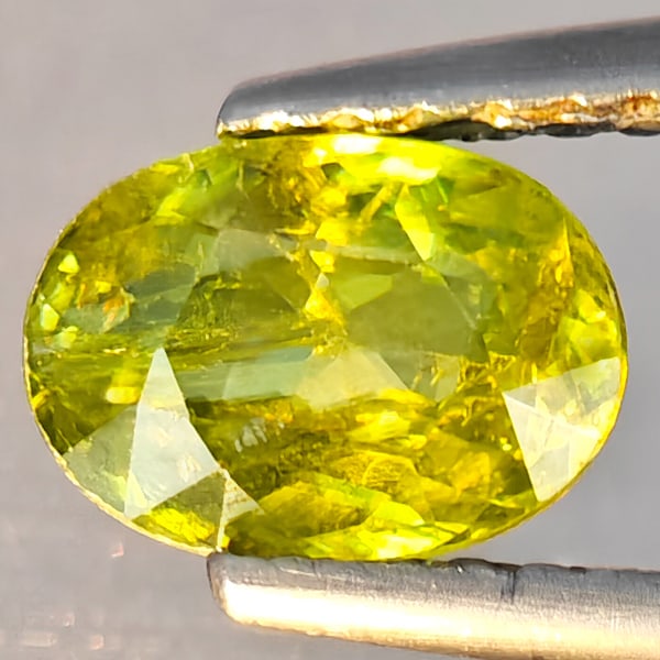 Natural Multi-Color With Rainbow Spark Sphene 0.96 Ct. Oval Shape 7.3 x 5.1 Mm Gemstone From (1 of 3)
