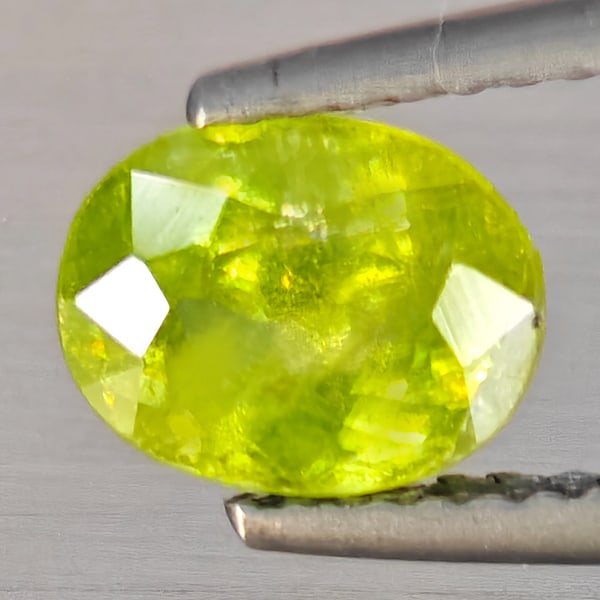 Natural Multi-Color With Rainbow Spark Sphene 1.30 Ct. Oval Shape 7.7 x 6.1 Mm Gemstone From (1 of 3)