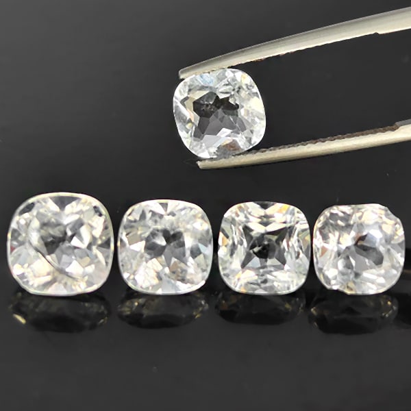 Natural White Topaz 11.32 Ct. 4 Pcs Cushoin Shape Gemstone From Brazil: Product ID: 807168824 Product Name: Natural Topaz Weight: 11.32 CT. Size: 9.2 x 9.2 x 6 to 8.3 x 8.3 x 4.2 MM. Shape: Cushion Shape Color: White Clarity:SI1 Luster: Good Gems Origin: Brazil Treatment: