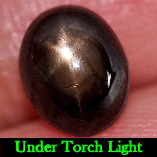 Natural Black Star Sapphire 6 Rays 3.31 Ct. Oval Cabochon Shape 8.6 x 7 Mm Gemstone From Thailand: Product ID: 806145240 Product Name: Natural Star Sapphire Weight: 3.31 CT. Size: 8.6 x 7 x 4.8 MM. Shape: Oval Cabochon Color: Black Clarity:Opaque Luster: Good 6 Rays Star Gems Origin: Thailand Treat