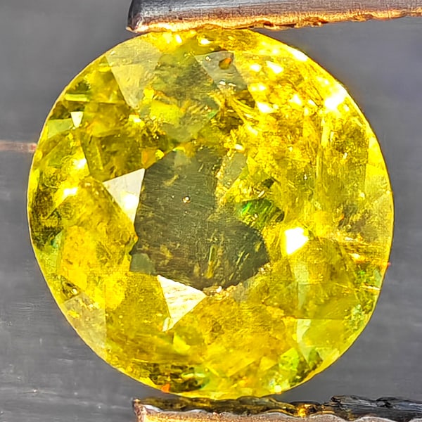 Natural Multi-Color With Rainbow Spark Sphene 0.98 Ct. Round Shape 6.3 Mm Gemstone From Madagascar: Product ID: 806509251 Product Name: Natural Sphene Weight: 0.98 CT. Size: 6.3 x 6.3 x 3.5 MM. Shape: Round Shape Color: Multi-Color Clarity:SI1 Luster: Good Gems Origin: Madagascar Treatment: Unheated