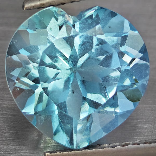 Natural Baby Blue Topaz 5.69 Ct. Heart Shape 11.1 Mm Gemstone From Brazil: Product ID: 807168750 Product Name: Natural Blue Topaz Weight: 5.69 CT. Size: 11.1 x 11.1 x 7 MM. Shape: Heart Shape Color: Baby Blue Clarity:VSI Luster: Good Gems Origin: Brazil Treatment: Treated Cr