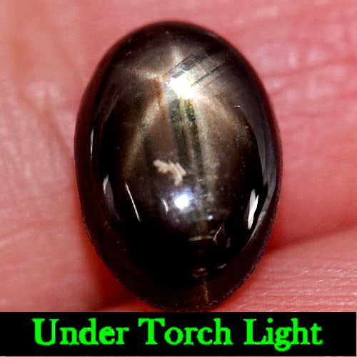 Natural Black Star Sapphire 6 Rays 3.21 Ct. Oval Cabochon Shape 9.7 x 6.6 Mm Gemstone from Thailand: Product ID: 806133844 Product Name: Natural Star Sapphire Weight: 3.21 CT. Size: 9.7 x 6.6 x 4.2 MM. Shape: Oval Cabochon Color: Black Clarity:Opaque Luster: Good 6 Rays Star Gems Origin: Thailand Tre