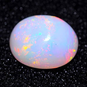 Natural Multi Color Opal 1.29 Ct. Oval Cabochon Shape 7.9 x 6.4 Mm Gemstone from Ethiopia (1 of 3)