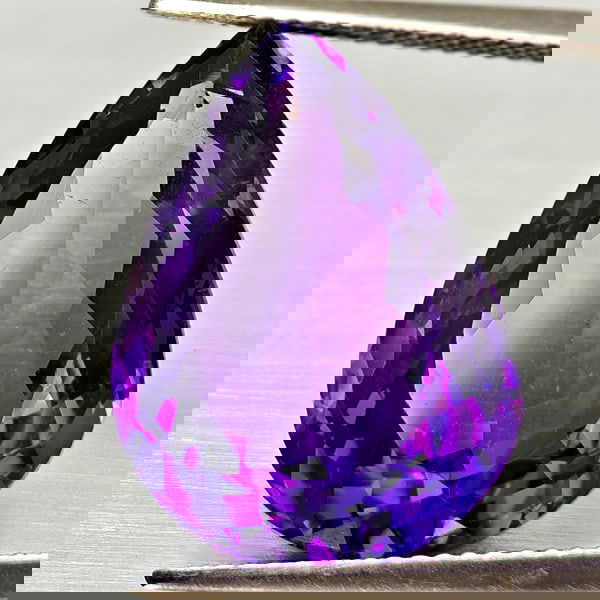 Natural Purple Amethyst 14.13 Ct. Pear Shape 19.4 x 14 Mm Gemstone From Brazil: Product ID: 800325512 Product Name: Natural Ametrine Weight: 14.13 CT. Size: 19.4 x 14 x 9.4 MM. Shape: Pear Shape Color: Purple Clarity:VSI Luster: Good Gems Origin: Brazil Treatment: Unheated