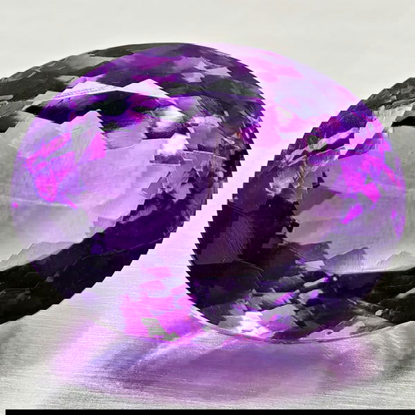 Natural Purple Amethyst 15.78 Ct. Oval Shape 17.1 x 13.4 Mm. Gemstone from Brazil: Product ID: 800325516 Product Name: Natural Amethyst Weight: 15.78 CT. Size: 17.1 x 13.4 x 10.6 MM. Shape: Oval Color: Purple Clarity:VSI Luster: Good Gems Origin: Brazil Treatment: Unheated Crystal