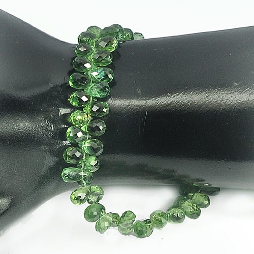 Natural Green Apatite 79.65 Ct. Briolette Cut 6.5 x 4.1 Mm. Beads Length 8 Inch Gemstone From: Product ID: 800607707 Product Name: Natural Apatite Weight: 79.65 CT. Size: 8 Inch. / 6.5 x 4.1 MM. Shape: Briolette With Drilled Color: Green Clarity:VVS Luster: Good Gems Origin: Tanzania