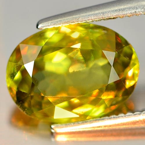Natural Multi Color Sphene 2.61 Ct. Oval Shape 9.9 x 7.3 Mm. Unheated Unheated: Product ID: 806505326 Product Name: Natural Sphene Weight: 2.61 CT. Size: 9.9 x 7.3 x 4.2 MM. Shape: Oval Color: Multi Color With Rainbow Spark Clarity:VSI Luster: Adamantine Gems Origin: Madagascar