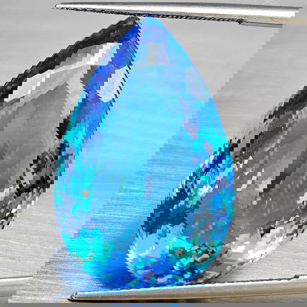 Natural Swiss Blue Topaz 32.03 Ct. VVS Pear Shape 25 x 16.5 Mm. Gemstone From Brazil: Product ID: 807168694 Product Name: Natural Blue Topaz Weight: 32.03 CT. Size: 25 x 16.5 x 10 MM. Shape: Pear Shape Color: Swiss Blue Clarity:VVS Luster: Good Gems Origin: Brazil Treatment: Treated Cr