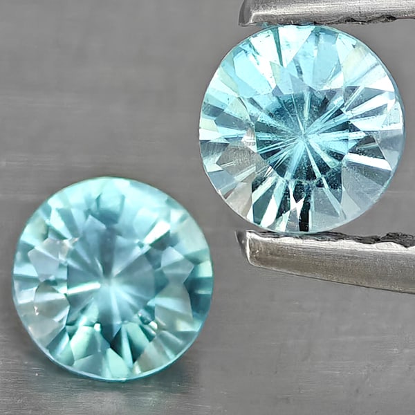 Natural Blue Zircon 0.97 Ct. 2 Pcs Round Diamond Cut 4.6 Mm Gemstone from Cambodia: Product ID: 807743267 Product Name: Natural Gemstones Weight: 0.97 CT. Size: 4.6 x 4.6 x 3 MM. Shape: Round Diamond Cut Color: Blue Clarity:SI1 Luster: Good Gems Origin: Cambodia Treatment: Heated Cry