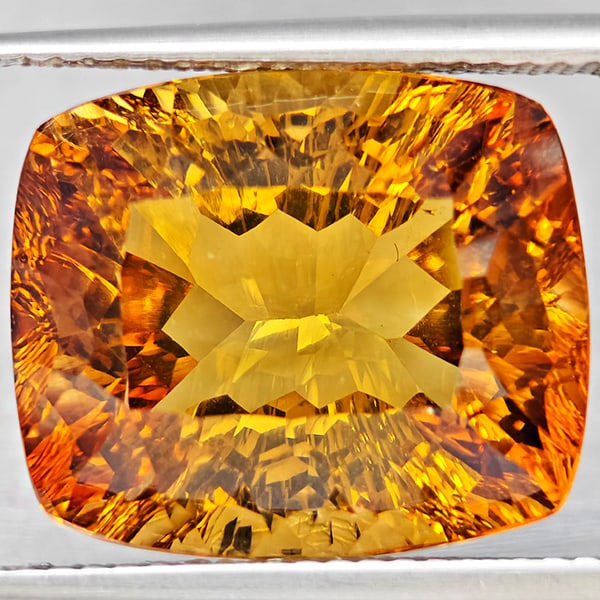 Natural Imperial Topaz 14.85 Ct. Cushion Concave Cut 15.5 x 13 Mm Gemstone From Brazil: Product ID: 807168626 Product Name: Natural Topaz Weight: 14.85 CT. Size: 15.5 x 13 x 9.1 MM. Shape: Cushion Concave Cut Color: Imperial Clarity:VSI Luster: Good Gems Origin: Brazil Treatment: Treated