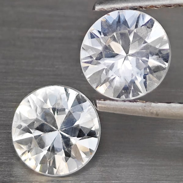 Natural White Zircon 2.57 Ct. 2 Pcs Round Diamond Cut 6.2 Mm Gemstone from Cambodia: Product ID: 807721002 Product Name: Natural Zircon Weight: 2.57 CT. Size: 6.2 x 6.2 x 3.6 MM. Shape: Round Diamond Cut Color: White Clarity:VVS Luster: Good Gems Origin: Columbia Treatment: Heated Cry