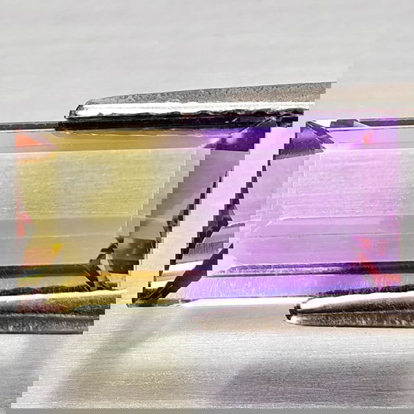 Natural Bi Color Ametrine 2.53 Ct. Octagon Shape 11.7 x 5.9 Mm Gemstone from Bolivia: Product ID: 800408303 Product Name: Natural Ametrine Weight: 2.53 CT. Size: 11.7 x 5.9 x 4.4 MM. Shape: Octagon Color: Bi Color Clarity:VSI Luster: Good Gems Origin: Bolivia Treatment: Unheated Crysta