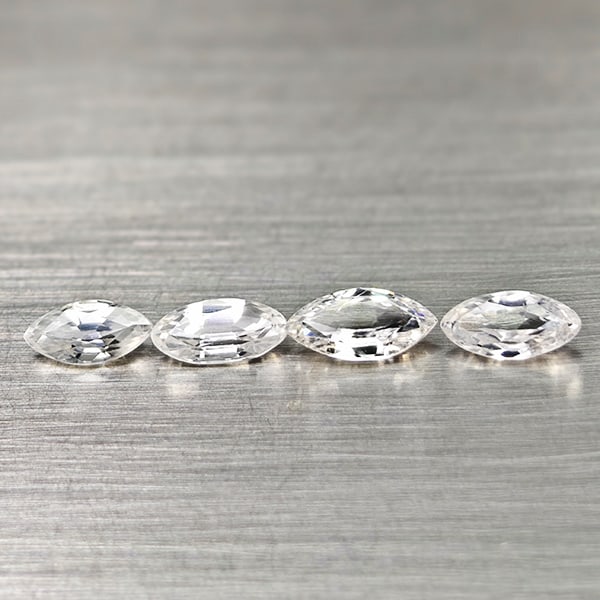 Natural White Zircon 2.65 Ct. 4 Pcs Maquise Shape 7.9 x 4.1 Mm. Gemstones From Cambodia: Product ID: 807742999 Product Name: Natural Zircon Weight: 2.65 CT. Size: 7.9 x 4.1 x 2.4 MM. Shape: Marquise Color: White Clarity:VSI Luster: Good Gems Origin: Cambodia Treatment: Heated Crystal Stru