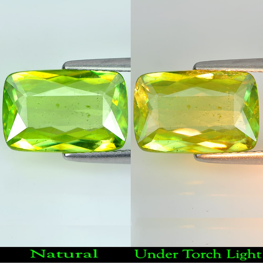 Natural Green Sphene With Rainbow Spark 4.58 Ct. Cushion Shape 13.2 x 8.8 Mm. Gemstone: Product ID: 806507982 Product Name: Natural Sphene Weight: 4.58 CT. Size: 13.2 x 8.8 x 4 MM. Shape: Cushion Color: Green With Rainbow Spark Clarity:SI1 Luster: Adamantine Gems Origin: Madagascar Treat