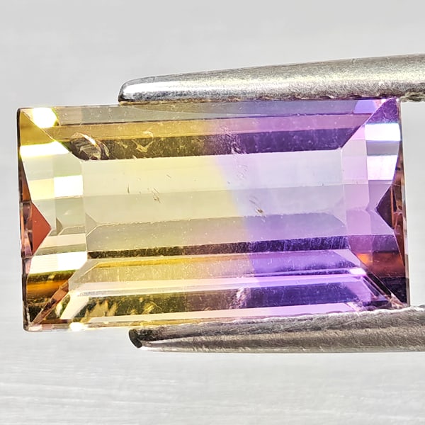 Natural Bi Color Ametrine 2.51 Ct. Octagon Shape 10.8 x 6.3 Mm Gemstone From Bolivia: Product ID: 800408373 Product Name: Natural Ametrine Weight: 2.51 CT. Size: 10.8 x 6.3 x 4.7 MM. Shape: Octagon Color: Bi Color Clarity:VSI Luster: Good Gems Origin: Bolivia Treatment: Unheated Crysta