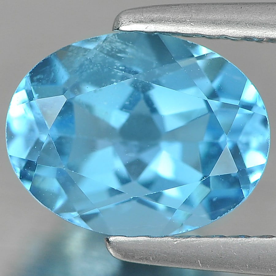 Natural Swiss Blue Topaz 2.39 Ct. Oval Shape 9.1 x 7.1 Mm Gemstone from Brazil: Product ID: 807161646 Product Name: Natural Blue Topaz Weight: 2.39 CT. Size: 9.1 x 7.1 x 4.9 MM. Shape: Oval Color: wiss Blue Clarity:VSI Luster: Good Gems Origin: Brazil Treatment: Treated Crystal S
