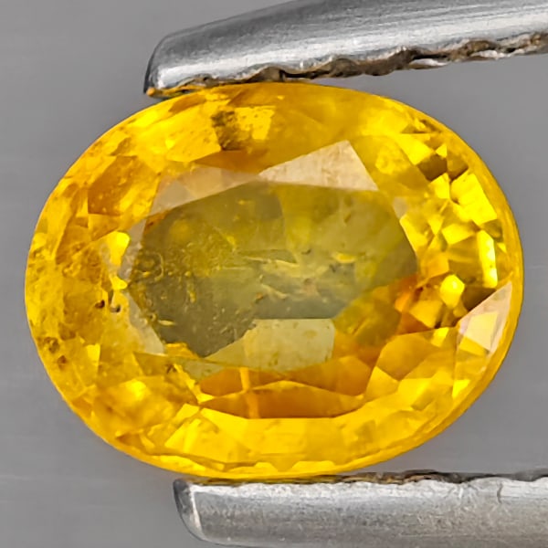 Natural Yellow Sapphire 0.92 Ct. Oval Shape 6.3 x 5 Mm Gemstone From Thailand: Product ID: 806130469 Product Name: Natural Yellow Sapphire Weight: 0.60 CT. Size: 6.3 x 5 x 3.2 MM. Shape: Oval Color: Yellow Clarity:SI1 Luster: Good Gems Origin: Thailand Treatment: Heated Crystal