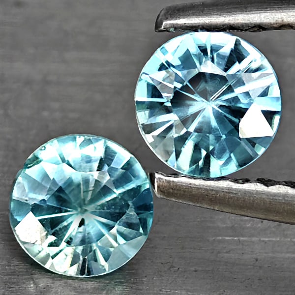 Natural Blue Zircon 0.91 Ct. 2 Pcs Round Diamond Cut 4.6 Mm Gemstone from Cambodia: Product ID: 807743268 Product Name: Natural Gemstones Weight: 0.91 CT. Size: 4.6 x 4.6 x 2.8 MM. Shape: Round Diamond Cut Color: Blue Clarity:SI1 Luster: Good Gems Origin: Cambodia Treatment: Heated C