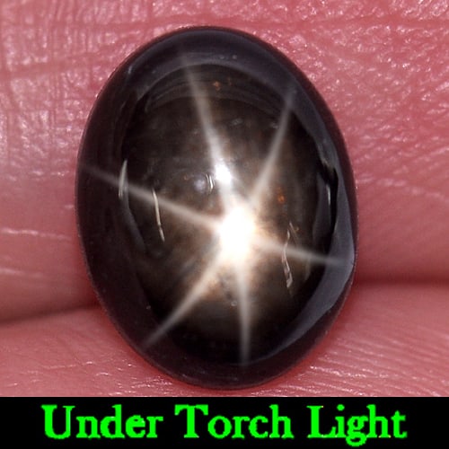 Natural Black Star Sapphire 6 Rays 3.50 Ct. Oval Cabochon Shape 9.6 x 7.4 Mm Gemstone From Thailand: Product ID: 806147672 Product Name: Natural Star Sapphire Weight: 3.50 CT. Size: 9.6 x 7.4 x 4.3 MM. Shape: Oval Cabochon Color: Black Clarity:Opaque Luster: Good 6 Rays Star Gems Origin: Thailand Tre