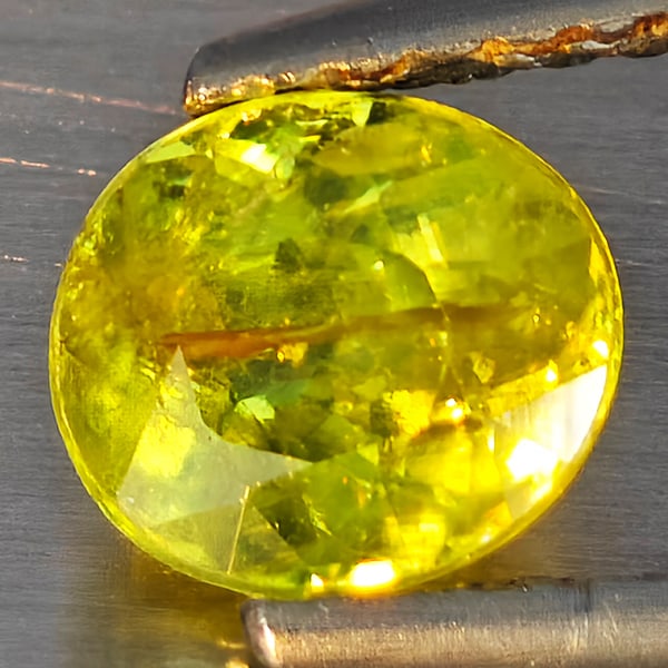 Natural Multi-Color With Rainbow Spark Sphene 0.87 Ct. Oval Shape 6.3 x 5.5 Mm Gemstone From: Product ID: 806509182 Product Name: Natural Sphene Weight: 0.87 CT. Size: 6.3 x 5.5 x 3.6 MM. Shape: Oval Shape Color: Multi-Color Clarity:SI1 Luster: Good Gems Origin: Madagascar Treatment: Unheated