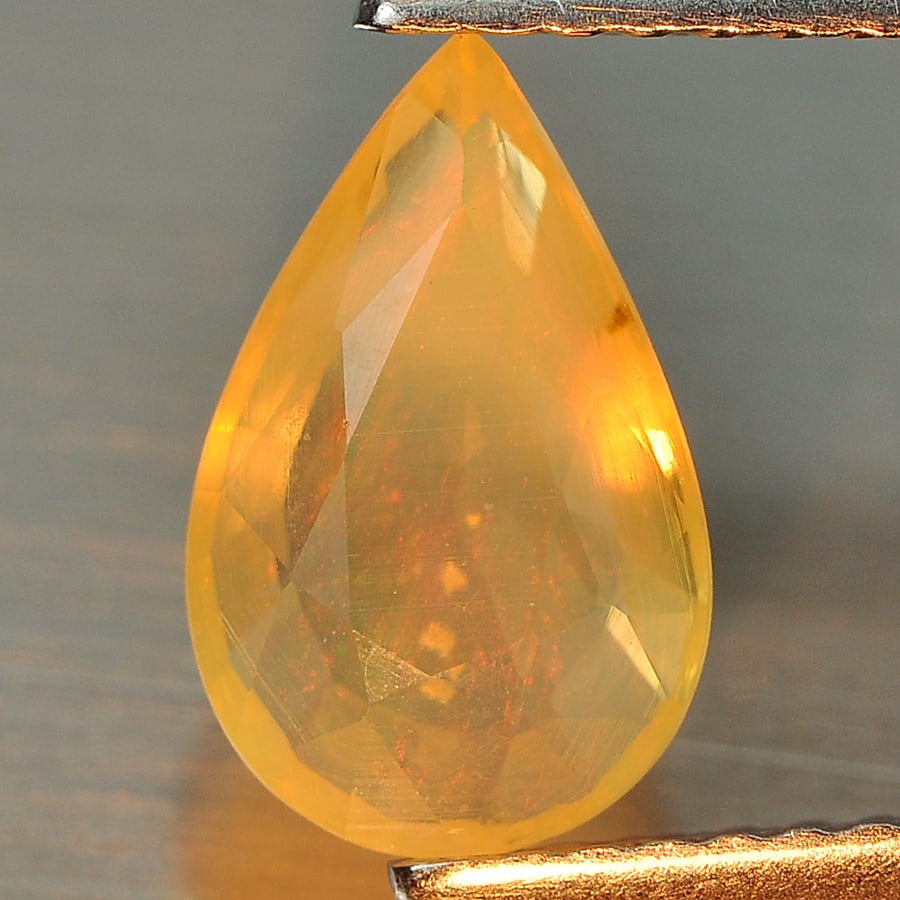 Natural Multi Color Opal 1.08 Ct. Pear Shape 10 x 6.5 Mm Gemstone from Ethiopia: Product ID: 818712057 Product Name: Natural Opal Weight: 1.08 CT. Size: 10 x 6.5 x 4 MM. Shape: Pear Color: Multi Color Clarity:Semi - Transparent Luster: Good Gems Origin: Ethiopia Treatment: Unheate