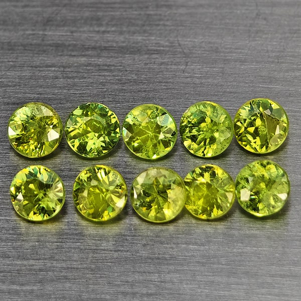 Natural Green Demantiod Garnet 1.49 Ct. 10 Pcs Round Diamond Cut 3.3 Mm Gemstones From Madagascar: Product ID: 802937657 Product Name: Natural Demantoid Weight: 1.49 CT. Size: 3.3 x 3.3 x 2.3 MM. Shape: Round Diamond Cut Color: Green Clarity:SI1 Luster: Good Gems Origin: Madagascar Treatment: Unhea