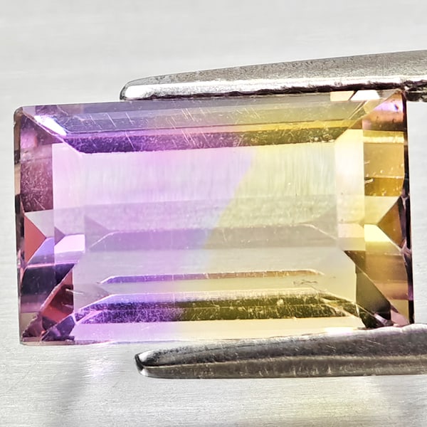 Natural Bi Color Ametrine 3.38 Ct. Octagon Shape 11.1 x 6.9 Mm Gemstone from Bolivia: Product ID: 800408333 Product Name: Natural Ametrine Weight: 3.38 CT. Size: 11.1 x 6.9 x 5.7 MM. Shape: Octagon Color: Bi Color Clarity:VSI - SI1 Luster: Good Gems Origin: Bolivia Treatment: Unheated