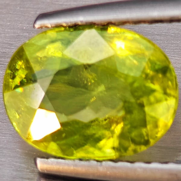 Natural Multi-Color Sphene With Rainbow Spark 1.75 Ct. Oval Shape 9.3 x 7.3 Mm Gemstone From: Product ID: 806509247 Product Name: Natural Sphene Weight: 1.75 CT. Size: 9.3 x 7.3 x 3.5 MM. Shape: Oval Shape Color: Multi-Color Clarity:SI1 Luster: Good Gems Origin: Madagascar Treatment: Unheated