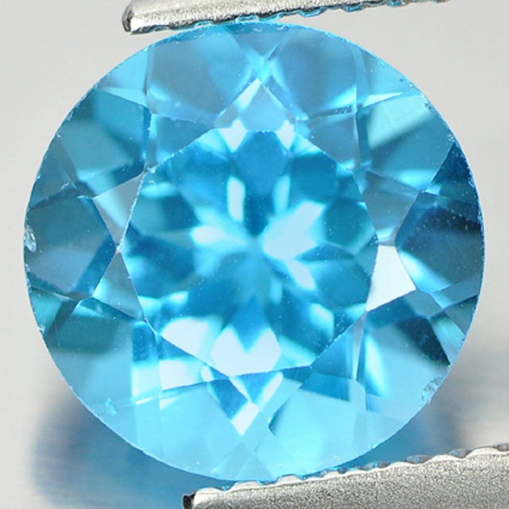 Natural Swiss Blue Topaz 3.33 Ct. Round Shape 9 Mm. Gemstone From Brazil: Product ID: 807156122 Product Name: Natural Blue Topaz Weight: 3.33 CT. Size: 9 x 9 x 6 MM. Shape: Round Color: Swiss Blue Clarity:VSI Luster: Good Gems Origin: Brazil Treatment: Treated Crystal Struc