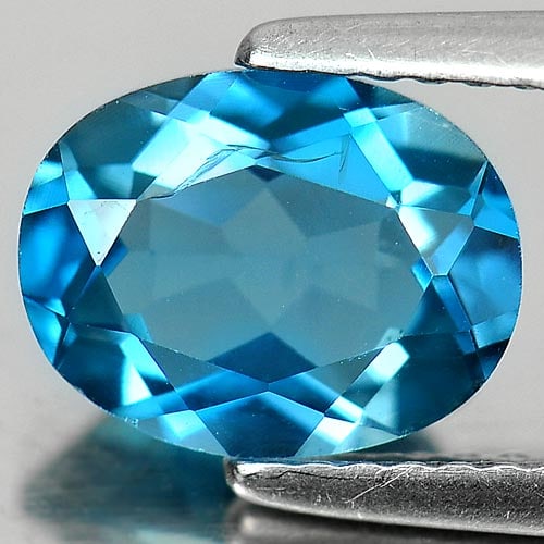 Natural London Blue Topaz 2.09 Ct. Oval Shape 9 x 7 Mm. Oval Shape 9 x 7 Mm. Gemstone From Brazil: Product ID: 807160903 Product Name: Natural Blue Topaz Weight: 2.09 CT. Size: 9 x 7 x 4.1 MM. Shape: Oval Color: London Blue Clarity:VSI Luster: Good Gems Origin: Brazil Treatment: Treated Crystal Str