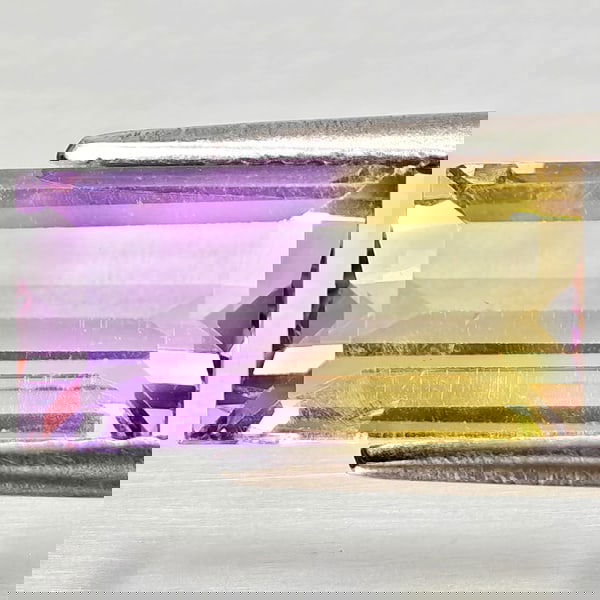 Natural Bi Color Ametrine 2.96 Ct. Octagon Shape 12.2 x 6.2 Mm Gemstone From Bolivia: Product ID: 800408315 Product Name: Natural Ametrine Weight: 2.96 CT. Size: 12.2 x 6.2 x 4.8 MM. Shape: Octagon Color: Bi Color Clarity:VSI - SI1 Luster: Good Gems Origin: Bolivia Treatment: Unheated