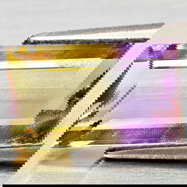 Natural Bi Color Ametrine 2.12 Ct. Octagon Shape 10.2 x 6.2 Mm Gemstone from Bolivia: Product ID: 800408345 Product Name: Natural Ametrine Weight: 2.12 CT. Size: 10.2 x 6.2 x 4.2 MM. Shape: Octagon Color: Bi Color Clarity:VSI - SI1 Luster: Good Gems Origin: Bolivia Treatment: Unheated