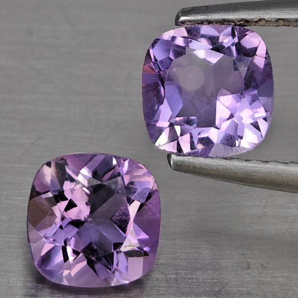 Natural Purple Amethyst 1.89 Ct. 2 Pcs Cushion Shape 6.4 Mm Gemstone From Brazil: Product ID: 800325553 Product Name: Natural Amethyst Weight: 1.89 CT. Size: 6.4 x 6.4 x 4.5 MM. Shape: Cushion Shape Color: Purple Clarity:VSI Luster: Good Gems Origin: Brazil Treatment: Unheated Crys