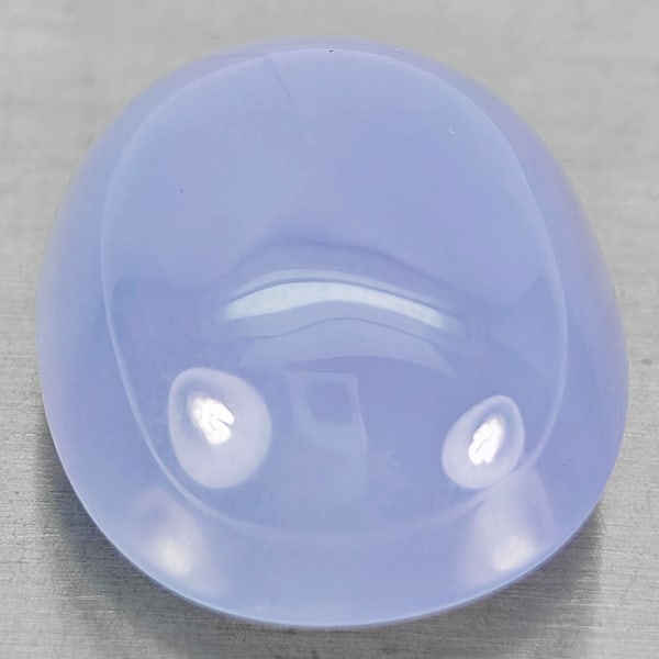 Natural Lavender Chalcedony 31.49 Ct. Oval Cabochon Shape 21 x 19 Mm Gemstone From Russia: Product ID: 801502735 Product Name: Natural Weight: 31.49 CT. Size: 21 x 19 x 11.5 MM. Shape: Oval Cabochon Color: Lavender Clarity:Semi - Transparent Luster: Good Gems Origin: Russia Treatment: Unhea