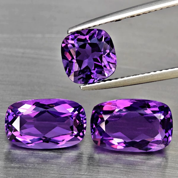 Natural Purple Amethyst 9.10 Ct. 3 Pcs Cushion Shape Gemstone From Brazil: Product ID: 800325640 Product Name: Natural Amethyst Weight: 9.10 CT. Size: 12 x 7.8 x 5.8 to 7.3 x 7.3 x 6.3 MM. Shape: Cushion Shape Color: Purple Clarity:VSI Luster: Good Gems Origin: Brazil Treatm